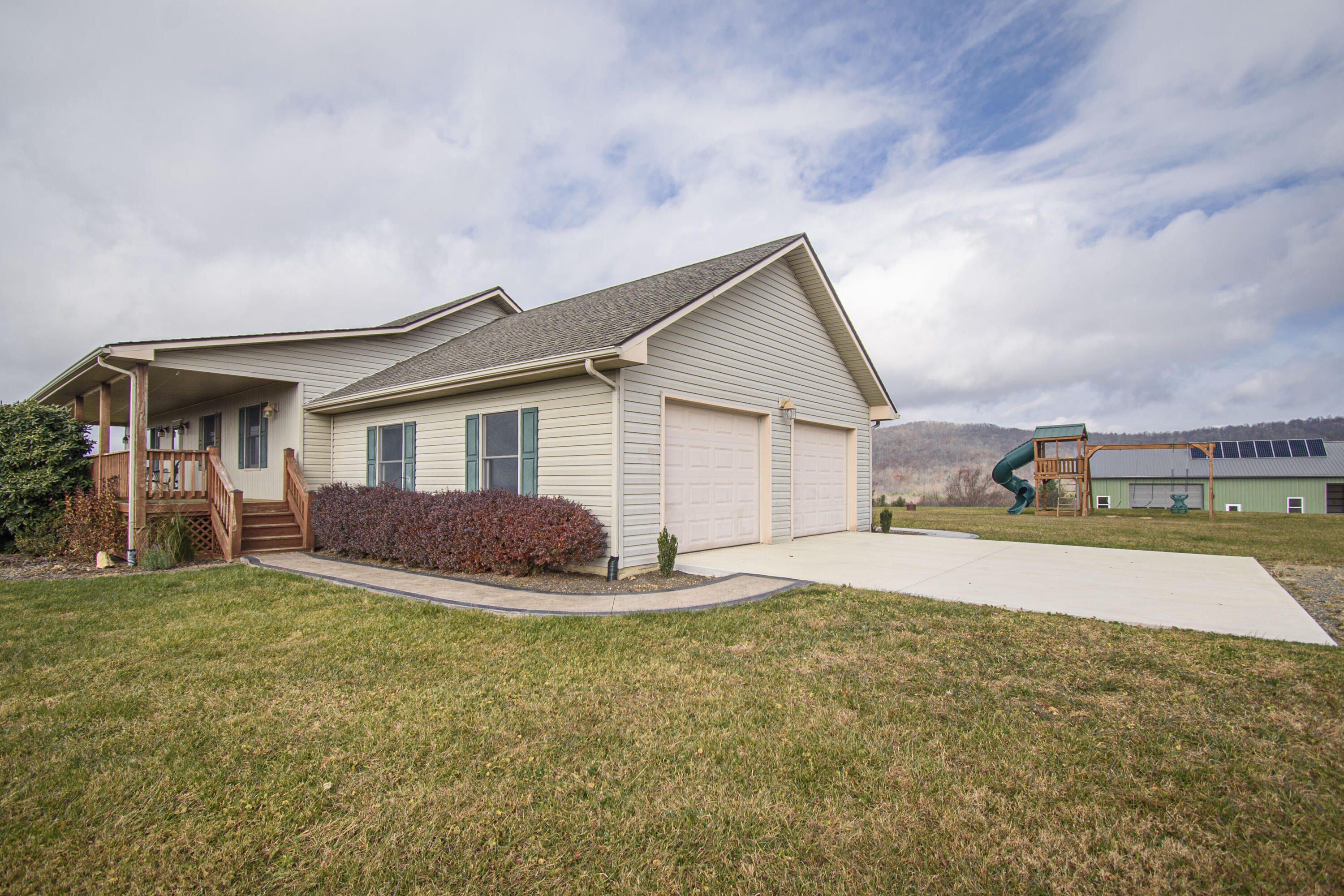 5485 Buffalo Mountain Road Southwest Willis, VA 24380 - Photo 5 of 77 a big house with a big yard and more windows