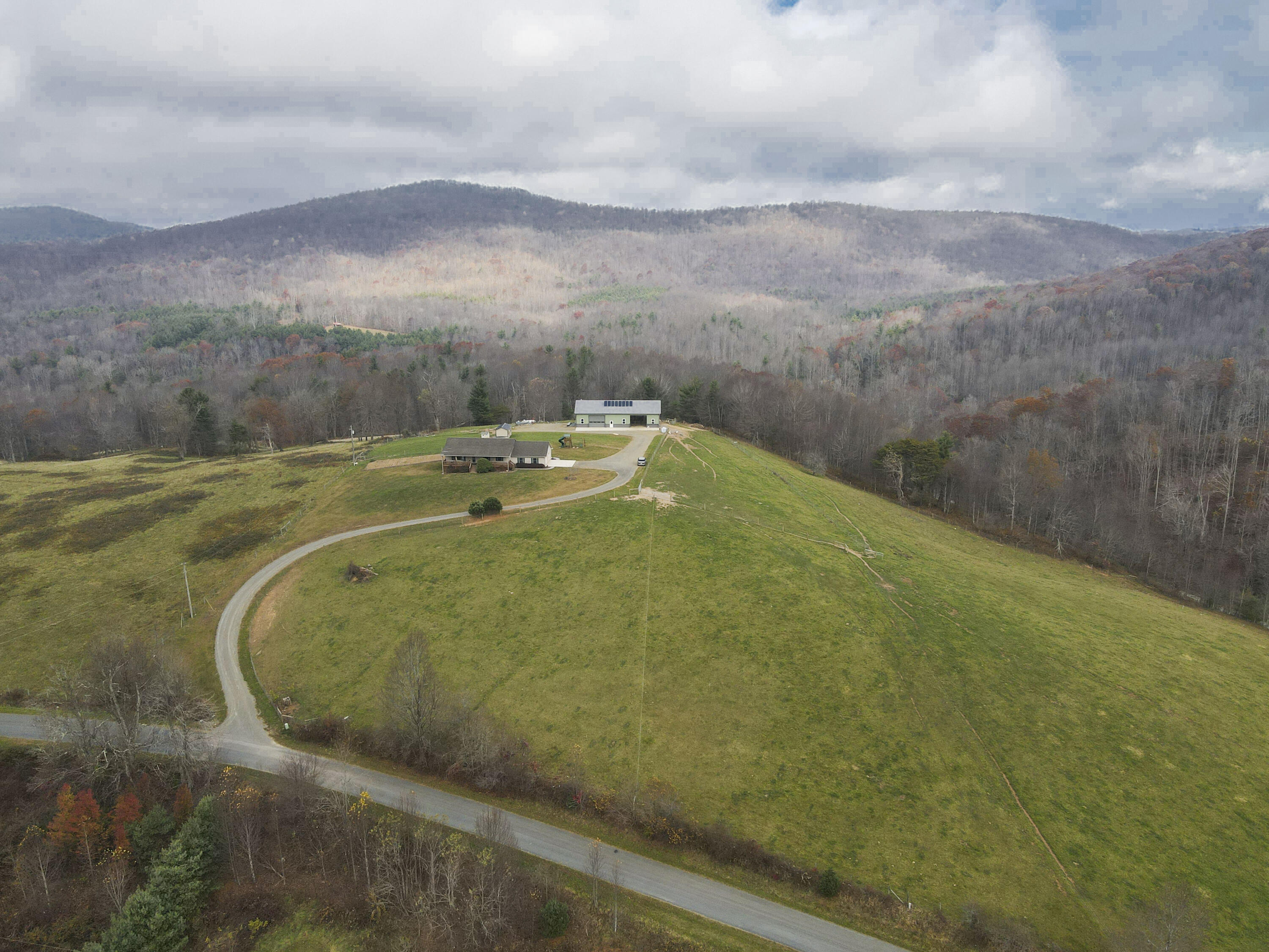 5485 Buffalo Mountain Road Southwest Willis, VA 24380 - Photo 66 of 77 a view of a swimming pool with a yard and mountain view in back