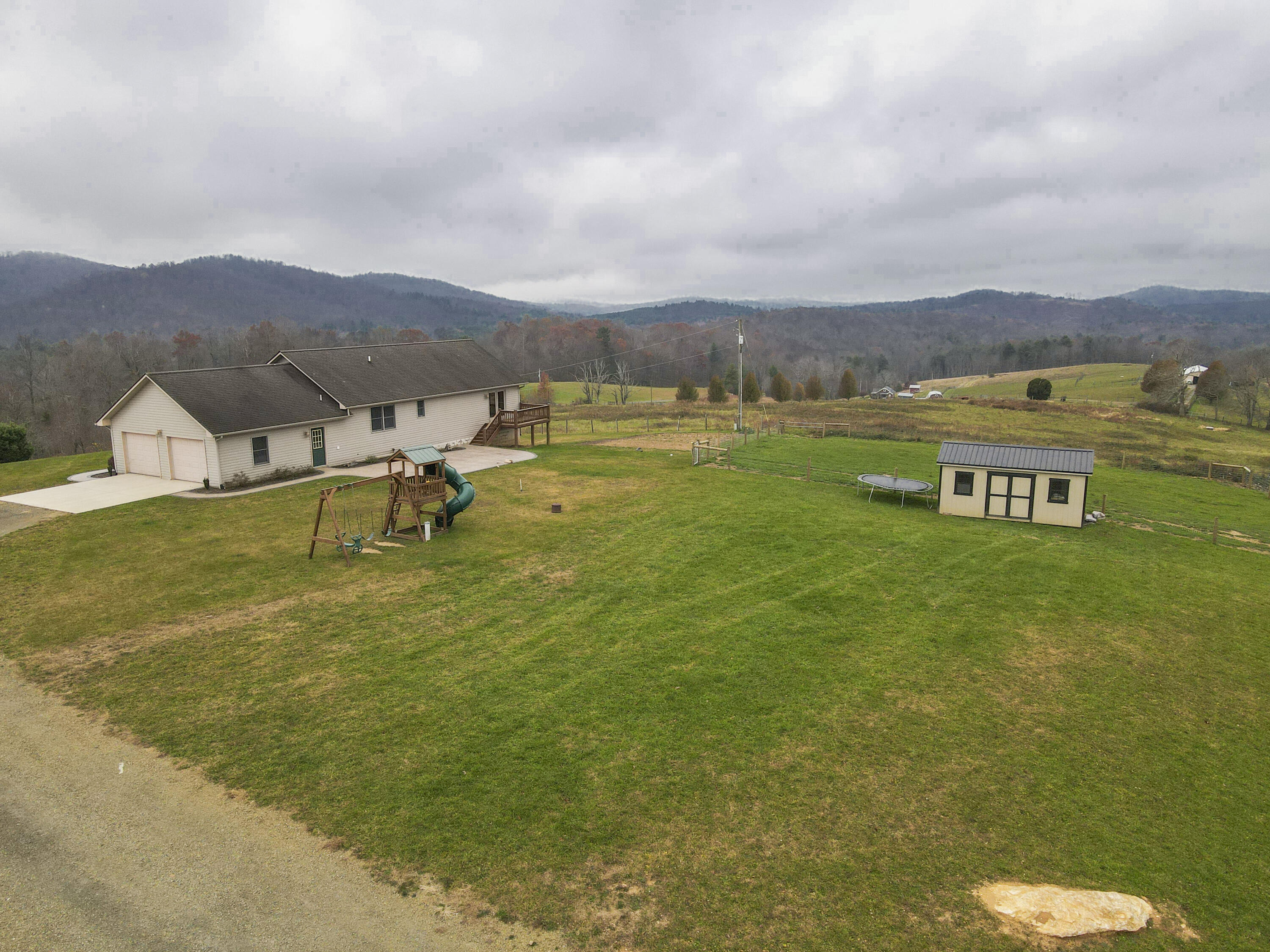 5485 Buffalo Mountain Road Southwest Willis, VA 24380 - Photo 72 of 77 a view of a lake with a mountain in the back