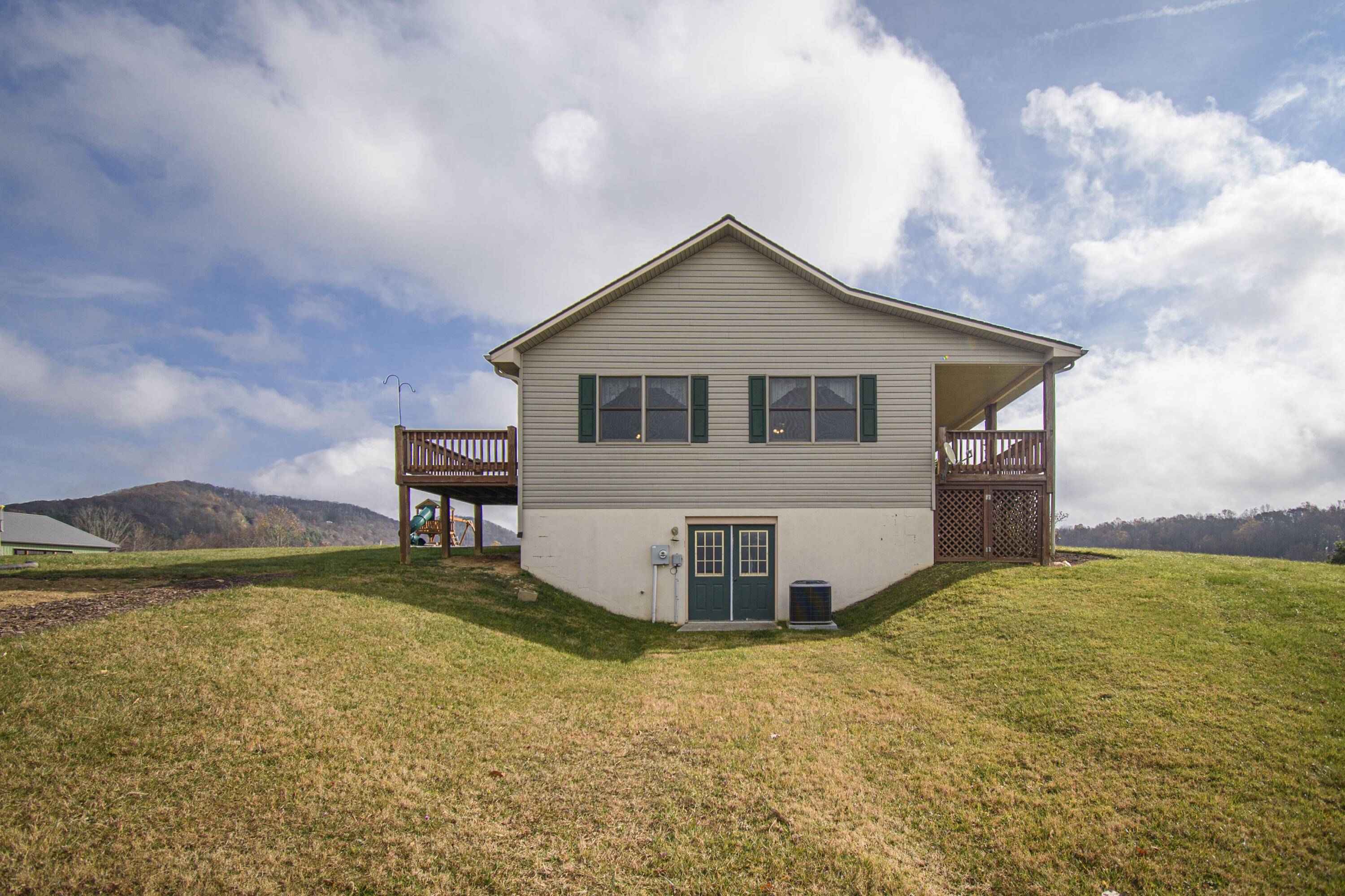 5485 Buffalo Mountain Road Southwest Willis, VA 24380 - Photo 10 of 77 a view of a house with backyard and lake view