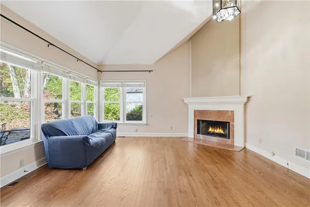 wooden floor in an empty room with a window and wooden floor