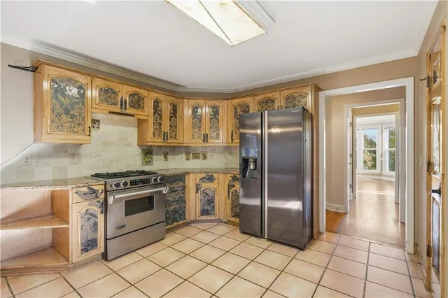a kitchen with a stove a sink and a refrigerator