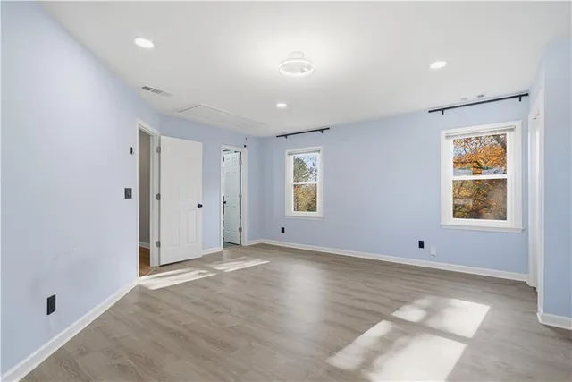 a bathroom with a granite countertop sink mirror and double