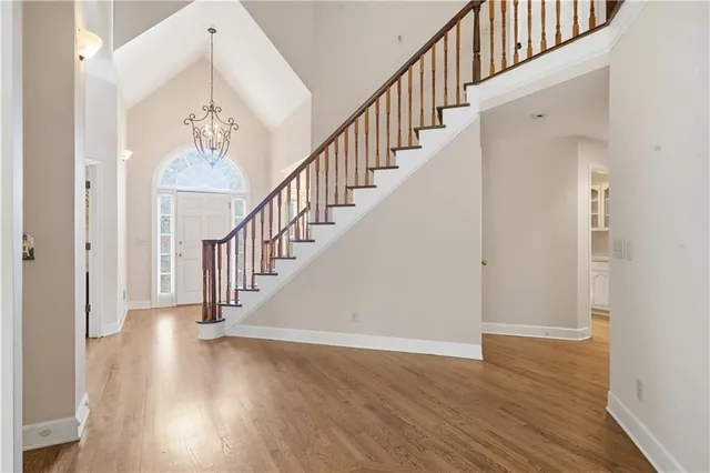 a view of staircase with wooden floor and staircase