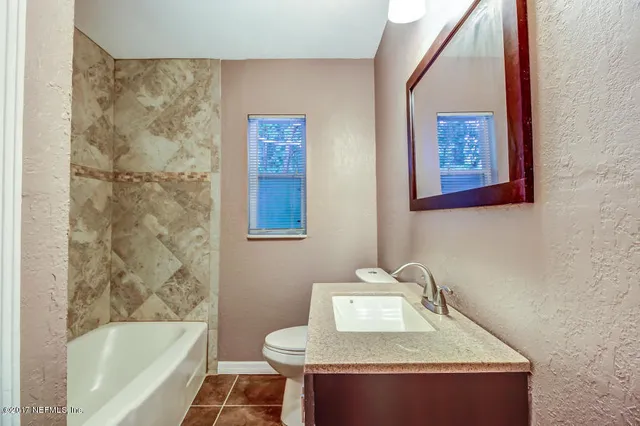 a bathroom with a sink and a bathtub