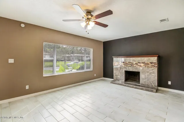 a view of livingroom window fireplace