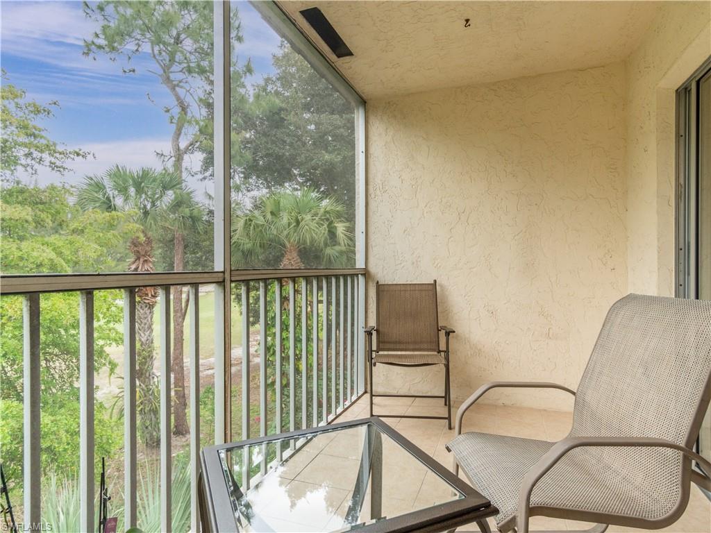 499 Forest Lakes Boulevard, Unit 2309 Naples, FL 34105 - Photo 12 of 29 a view of a balcony with chairs