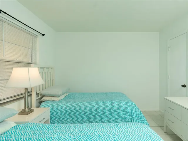 a bedroom with a bed and a table