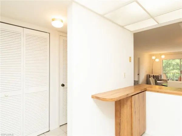 a view of a kitchen from the hallway