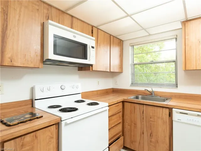 a kitchen with a stove and a microwave