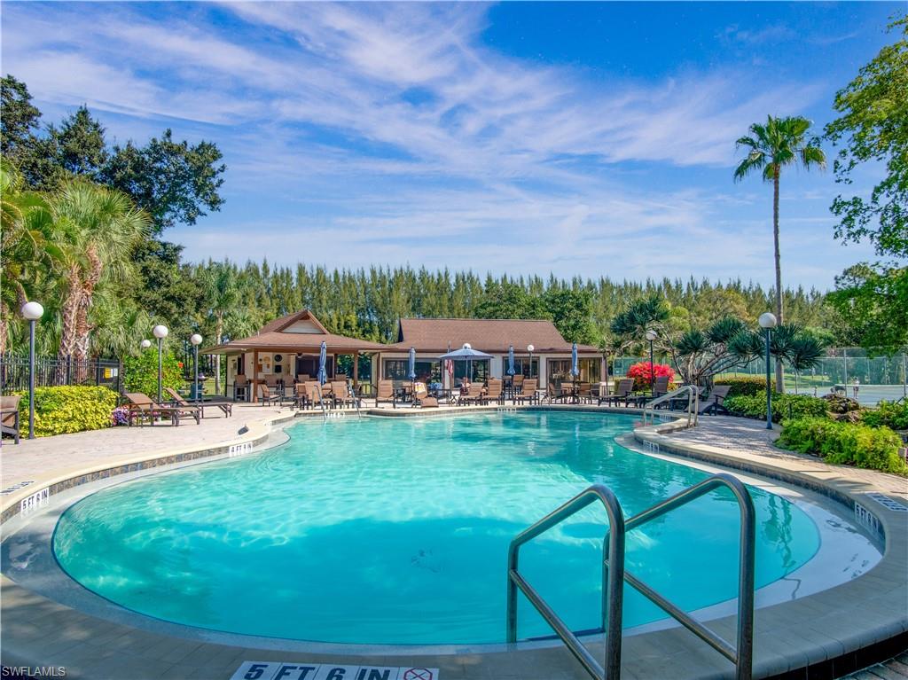 499 Forest Lakes Boulevard, Unit 2309 Naples, FL 34105 - Photo 4 of 29 a view of a house with backyard porch and sitting area