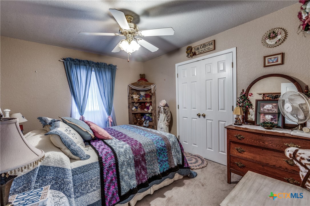 1408 County Road 3300 Kempner, TX 76539 - Photo 21 of 25 a bedroom with a bed and a dresser