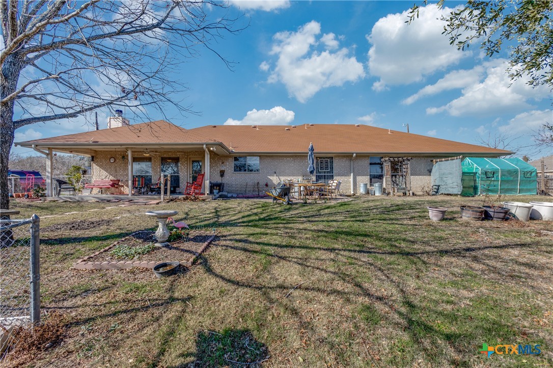 1408 County Road 3300 Kempner, TX 76539 - Photo 23 of 25 a view of a patio with a table and chairs under an umbrella