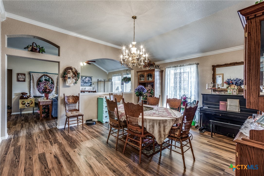 1408 County Road 3300 Kempner, TX 76539 - Photo 9 of 25 a view of a dining room with furniture window and wooden floor