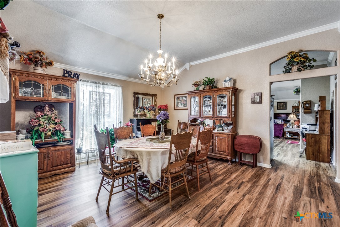 1408 County Road 3300 Kempner, TX 76539 - Photo 10 of 25 a view of a dining room with furniture and chandelier