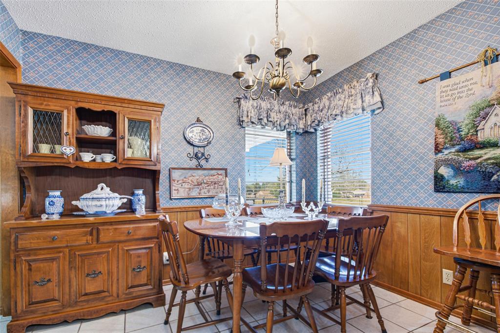 14202 Valleyview Ridge Tyler, TX 75709 - Photo 11 of 29 a view of a dining room with furniture a chandelier and wooden floor