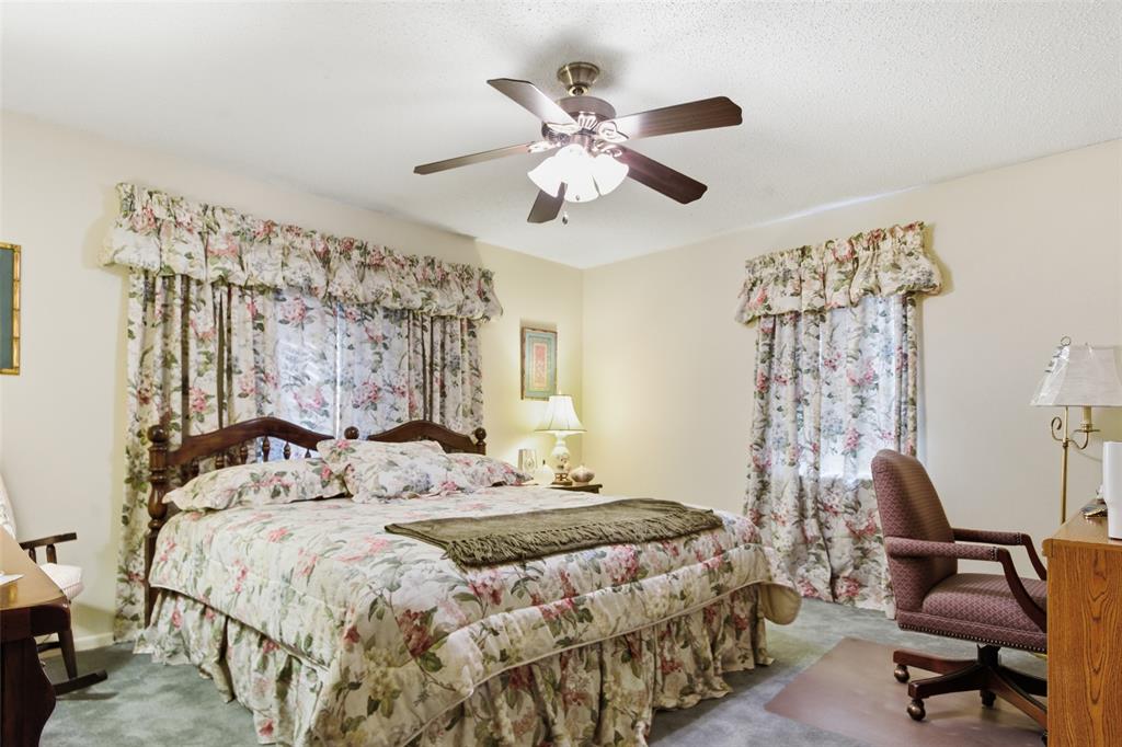 14202 Valleyview Ridge Tyler, TX 75709 - Photo 14 of 29 a bedroom with a bed and a window