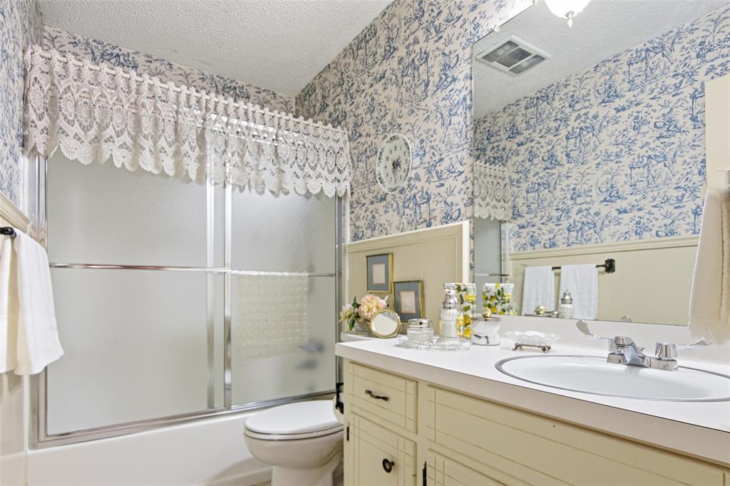 14202 Valleyview Ridge Tyler, TX 75709 - Photo 15 of 29 a bathroom with a sink a toilet and shower