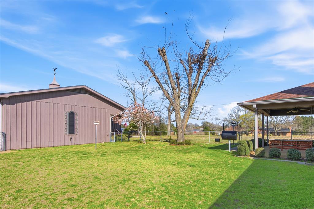 14202 Valleyview Ridge Tyler, TX 75709 - Photo 18 of 29 a view of a backyard with a garden