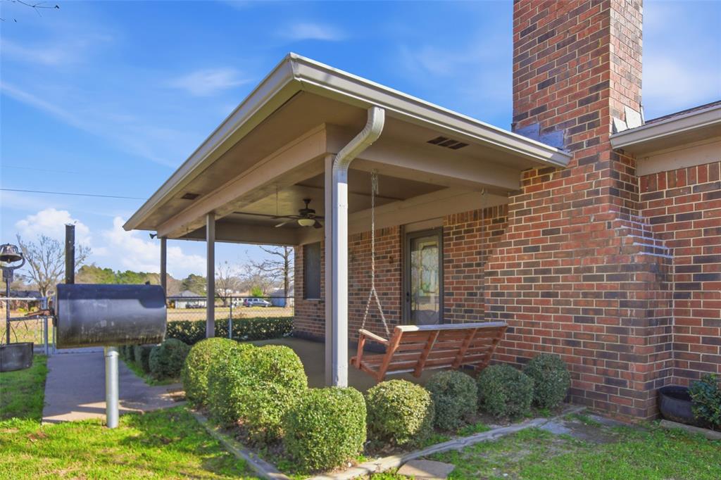 14202 Valleyview Ridge Tyler, TX 75709 - Photo 19 of 29 a front view of a house with garden
