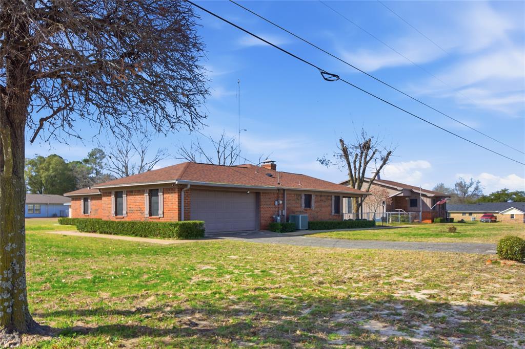 14202 Valleyview Ridge Tyler, TX 75709 - Photo 2 of 29 a front view of a house with garden