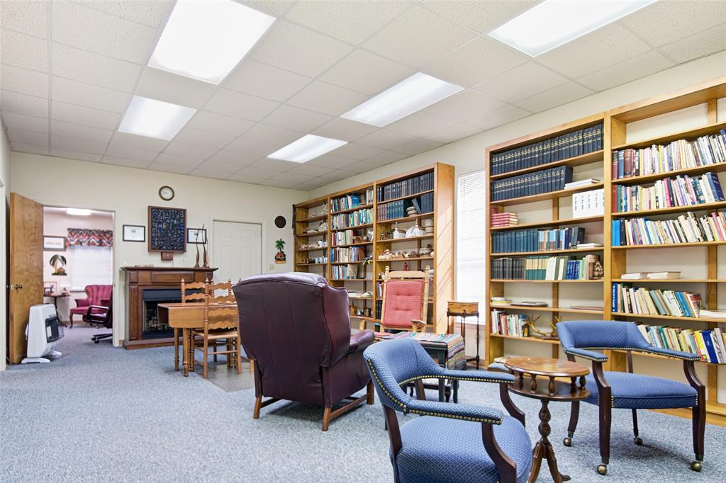 14202 Valleyview Ridge Tyler, TX 75709 - Photo 25 of 29 a view of a livingroom with workspace and a bookshelf