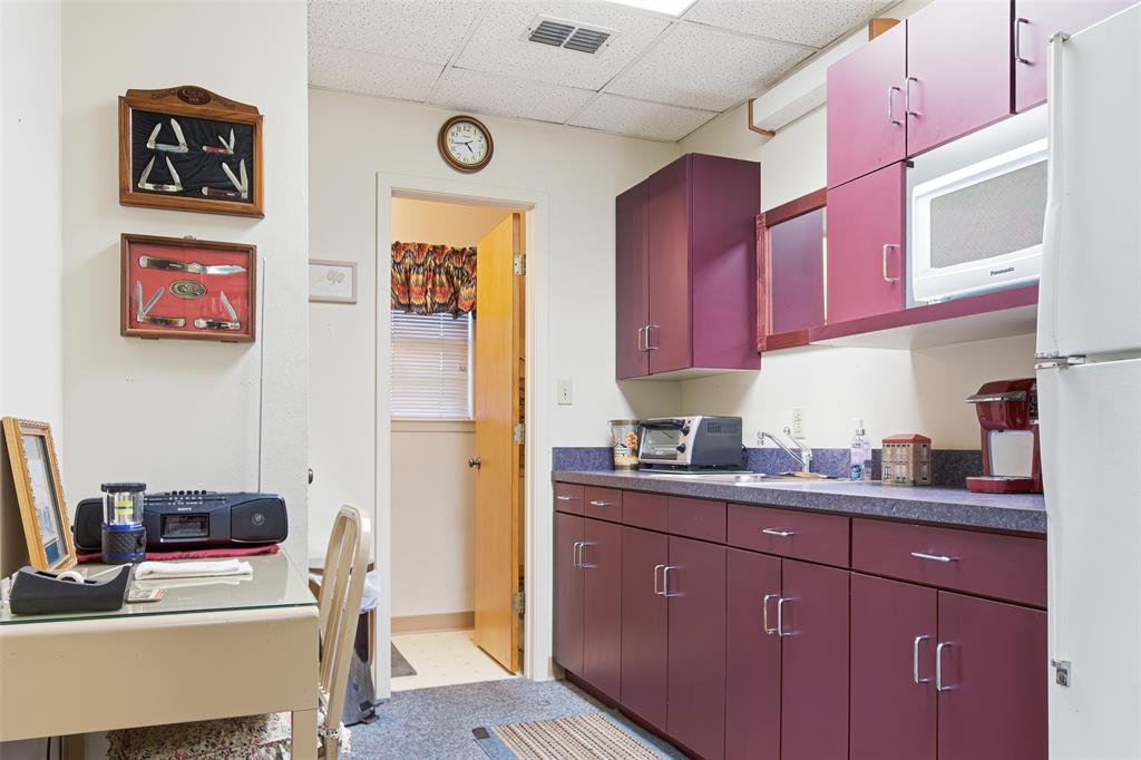 14202 Valleyview Ridge Tyler, TX 75709 - Photo 27 of 29 a kitchen with a sink cabinets and chair