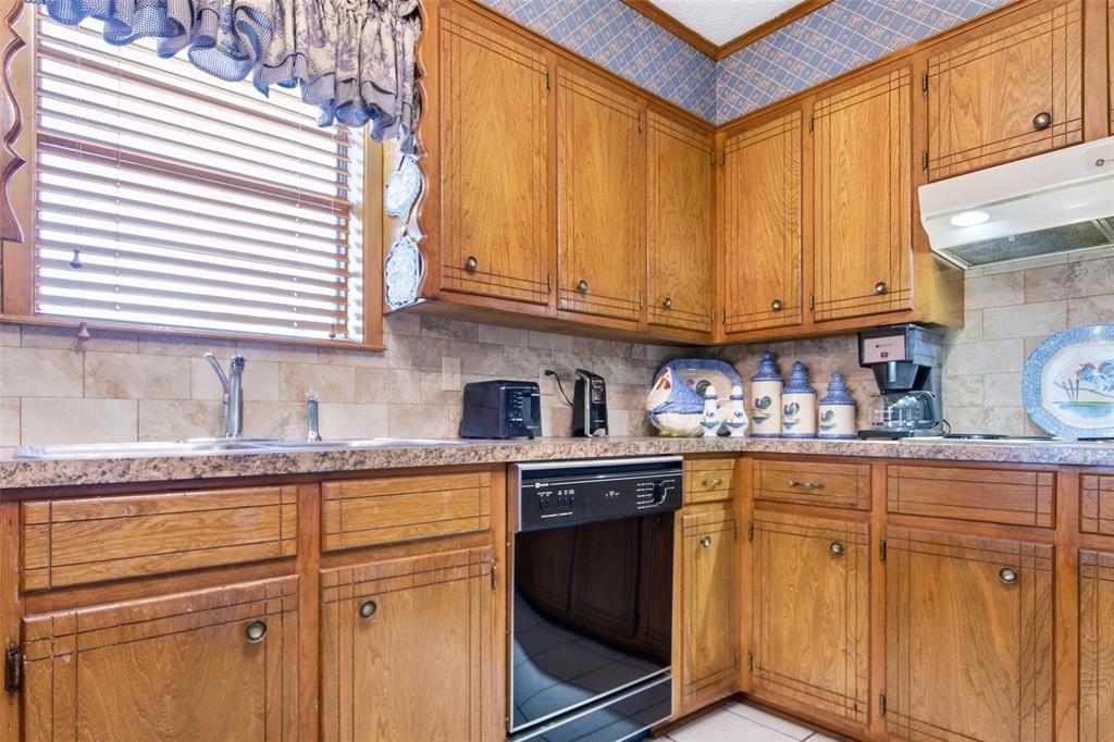 14202 Valleyview Ridge Tyler, TX 75709 - Photo 9 of 29 a kitchen with stainless steel appliances granite countertop a sink and cabinets