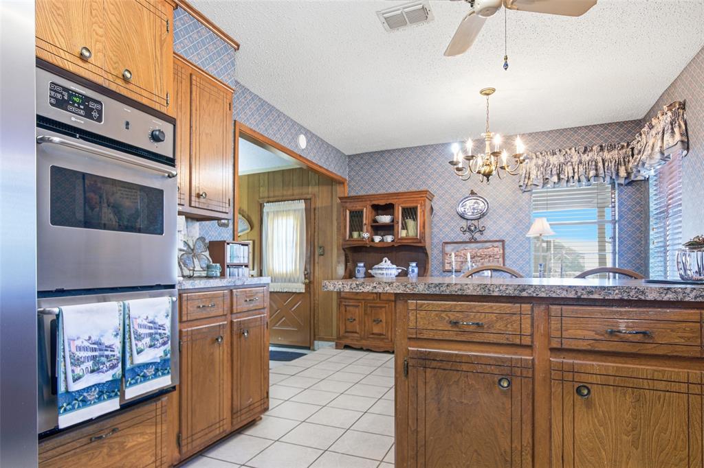 14202 Valleyview Ridge Tyler, TX 75709 - Photo 10 of 29 a kitchen with cabinets and window