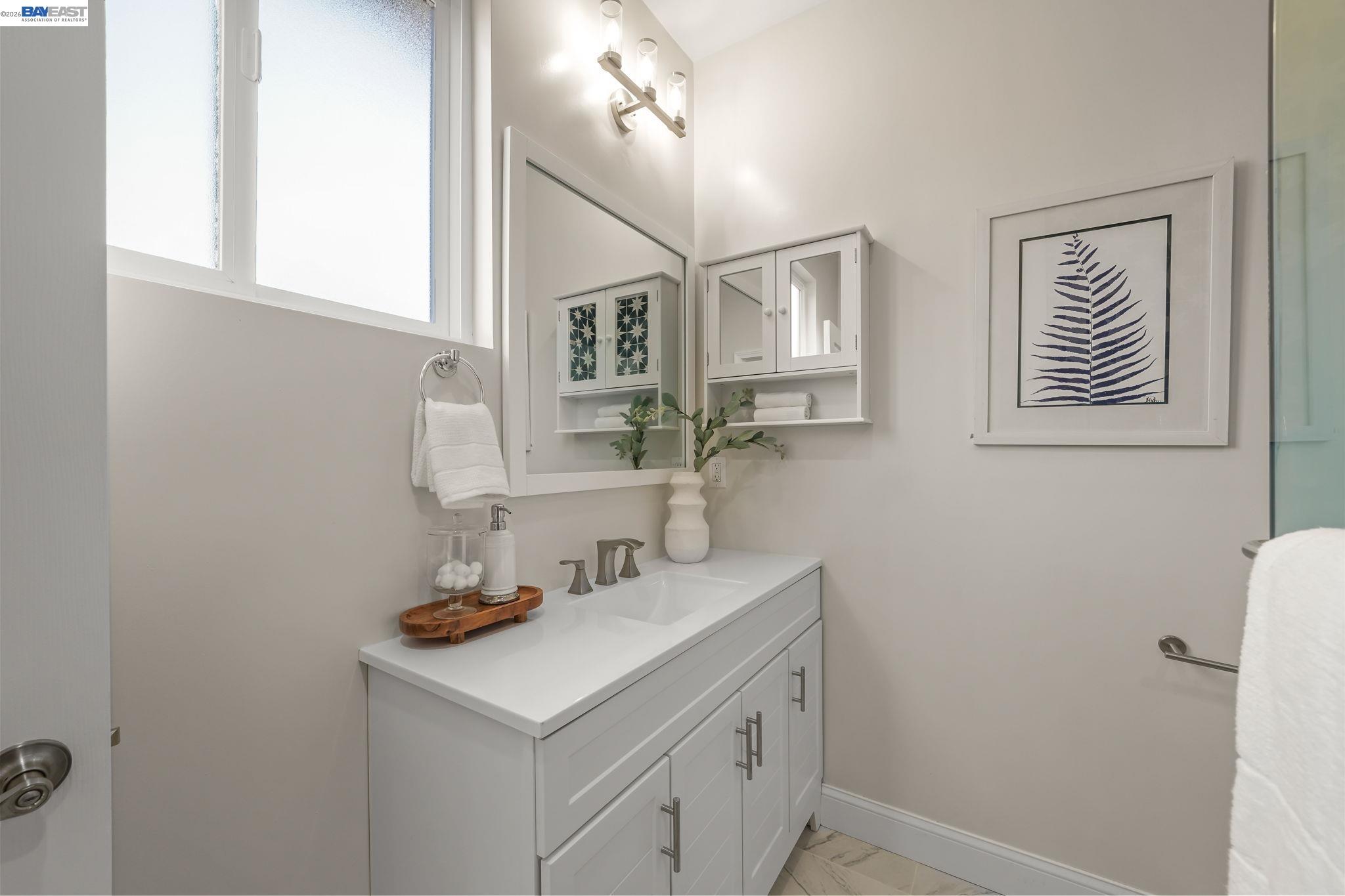 40772 Blacow Road Fremont, CA 94538 - Photo 29 of 40 a bathroom with a sink and a mirror