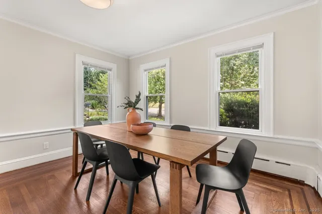 a view of a dining table and chairs in a room
