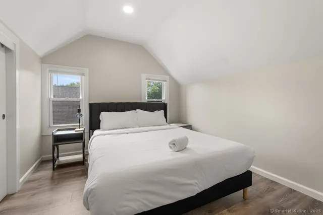 a bedroom with a bed and a table