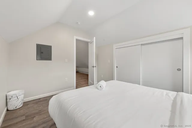 a large white bed in a white room