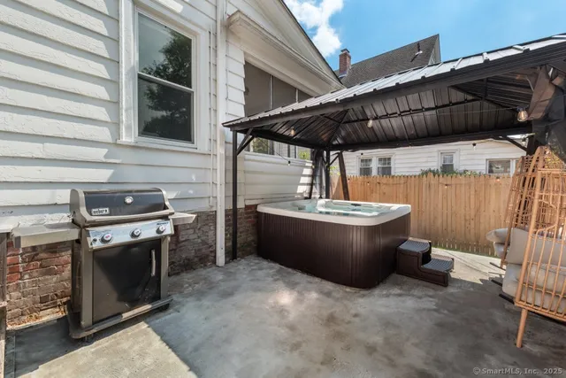 a view of a back yard with a patio