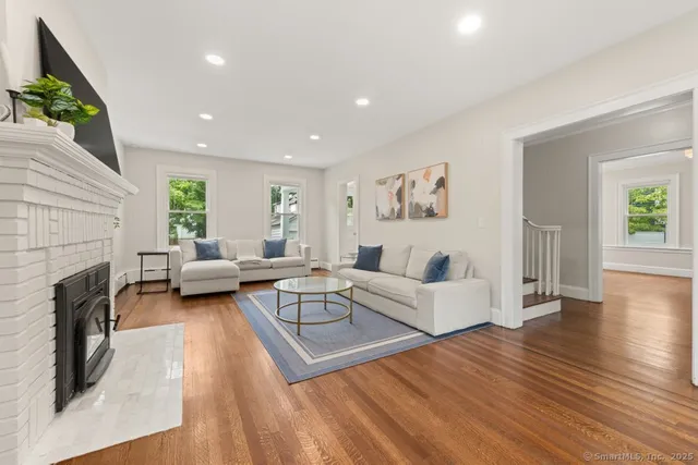 a living room with furniture or fireplace and a wooden floor