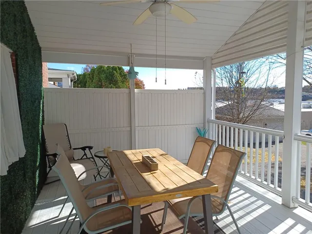 a view of a patio with a table and chairs