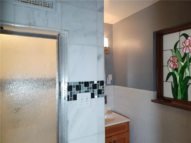 a view of kitchen with microwave and window