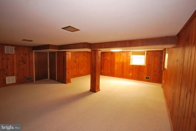 a view of an empty room with furniture