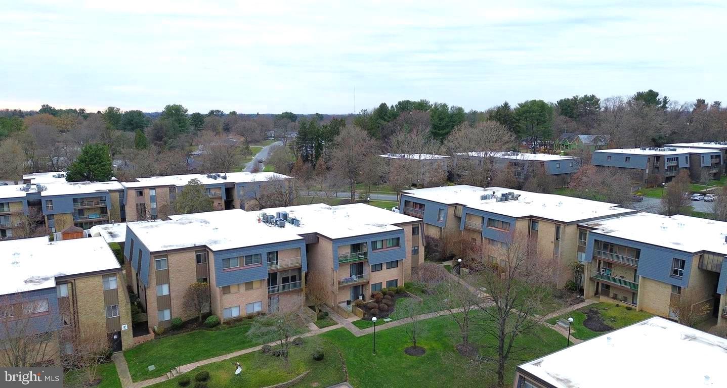 33 Stonehenge Circle, Unit 11 Baltimore, MD 21208 - Photo 19 of 22 a view of a dinning table and chairs in the patio