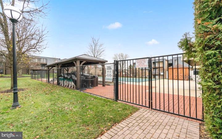 33 Stonehenge Circle, Unit 11 Baltimore, MD 21208 - Photo 20 of 22 a view of a porch with a backyard