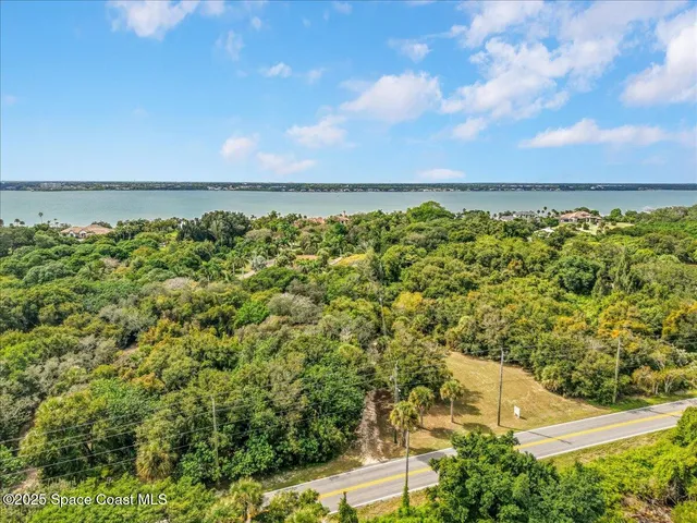 a view of a street with an ocean