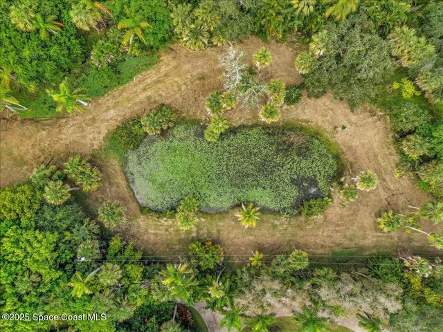 a view of a house with a yard and garage