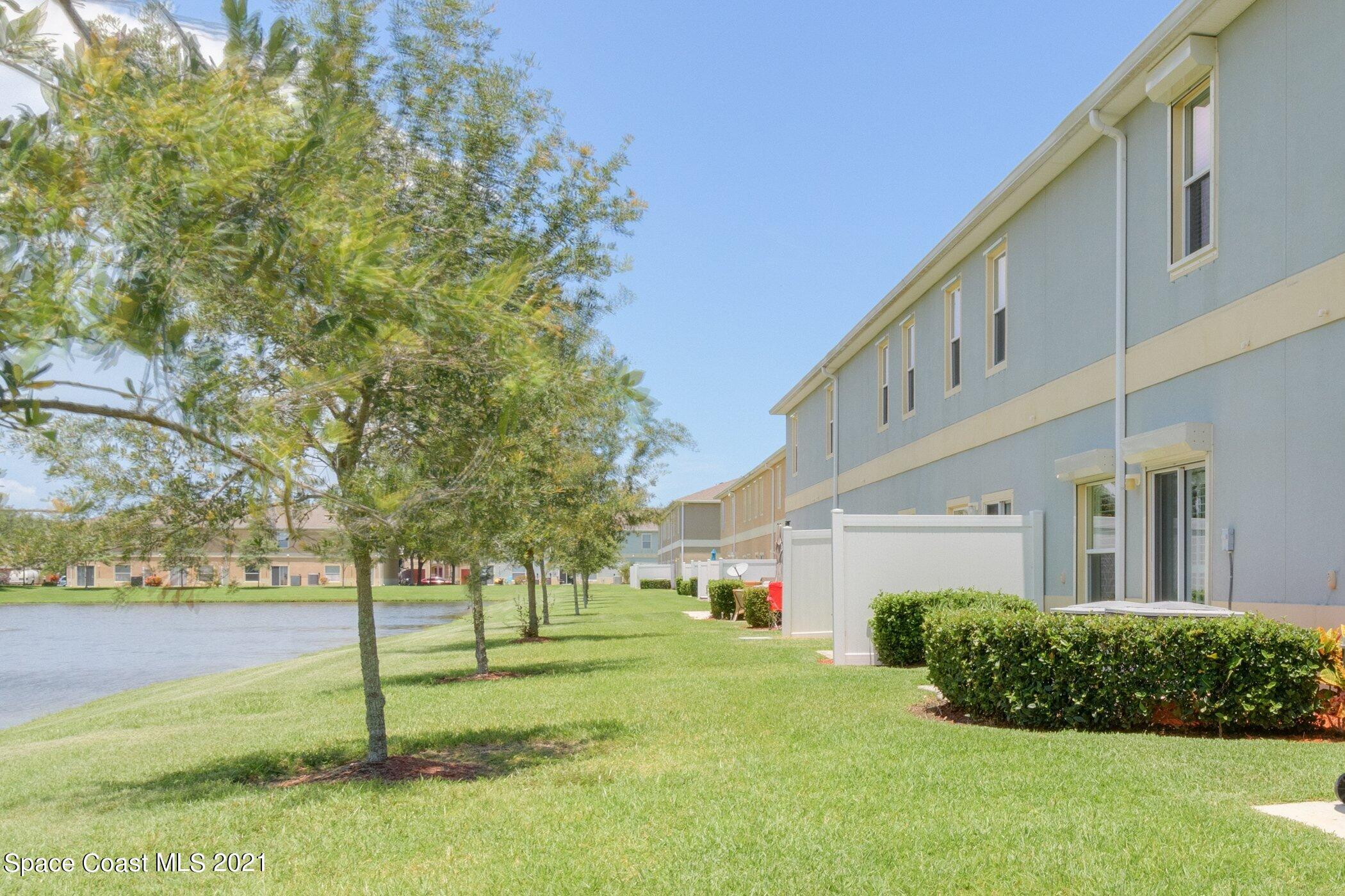 2780 Reston Street, Unit 102 Melbourne, FL 32935 - Photo 27 of 36 a view of a house with a yard