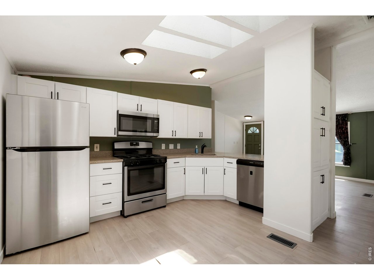 8451 Madison Way Denver, CO 80229 - Photo 6 of 27 Kitchen with Stainless Steel Appliances and Granite Counter Tops