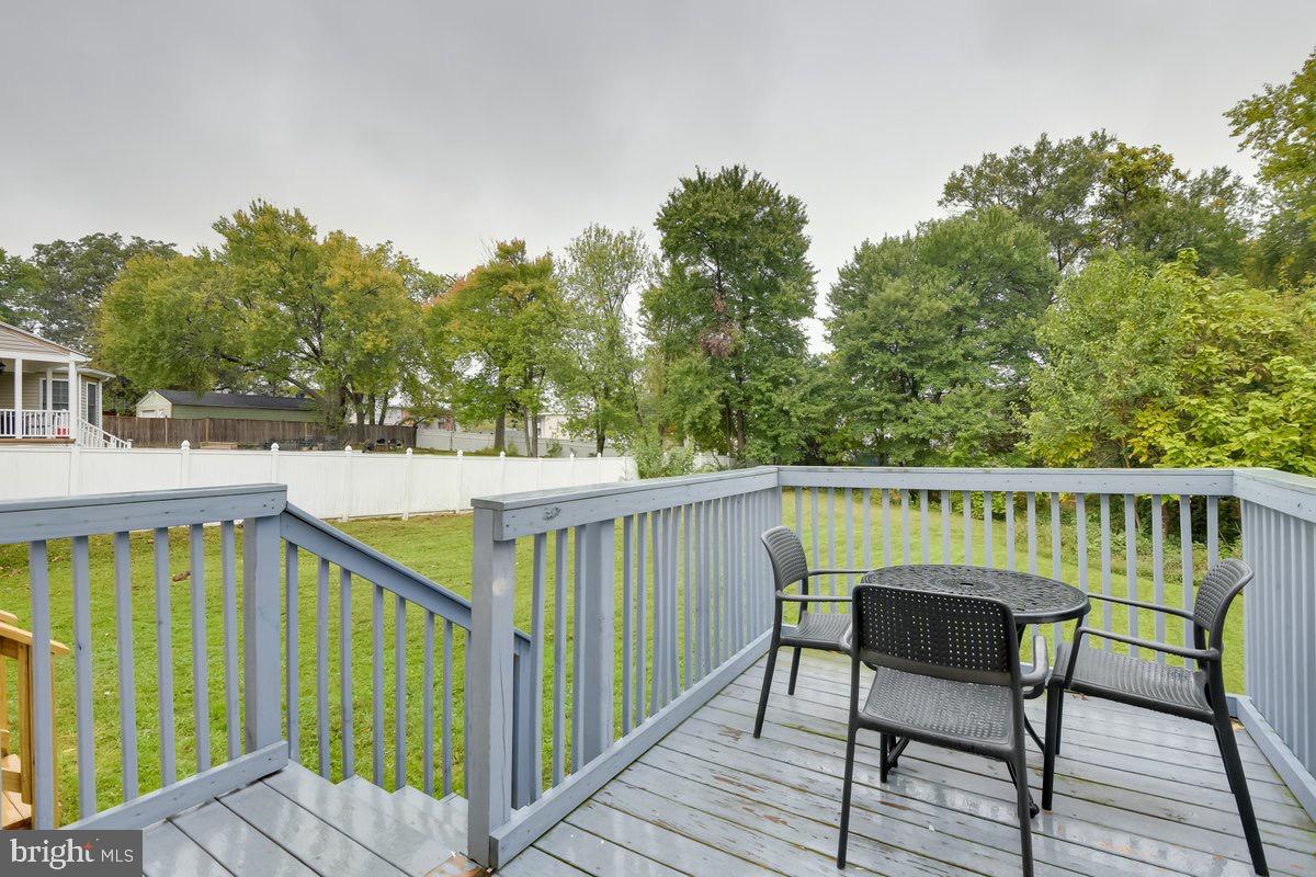 6604 Oak Street Cheverly, MD 20785 - Photo 14 of 16 a view of balcony with wooden floor and outdoor seating