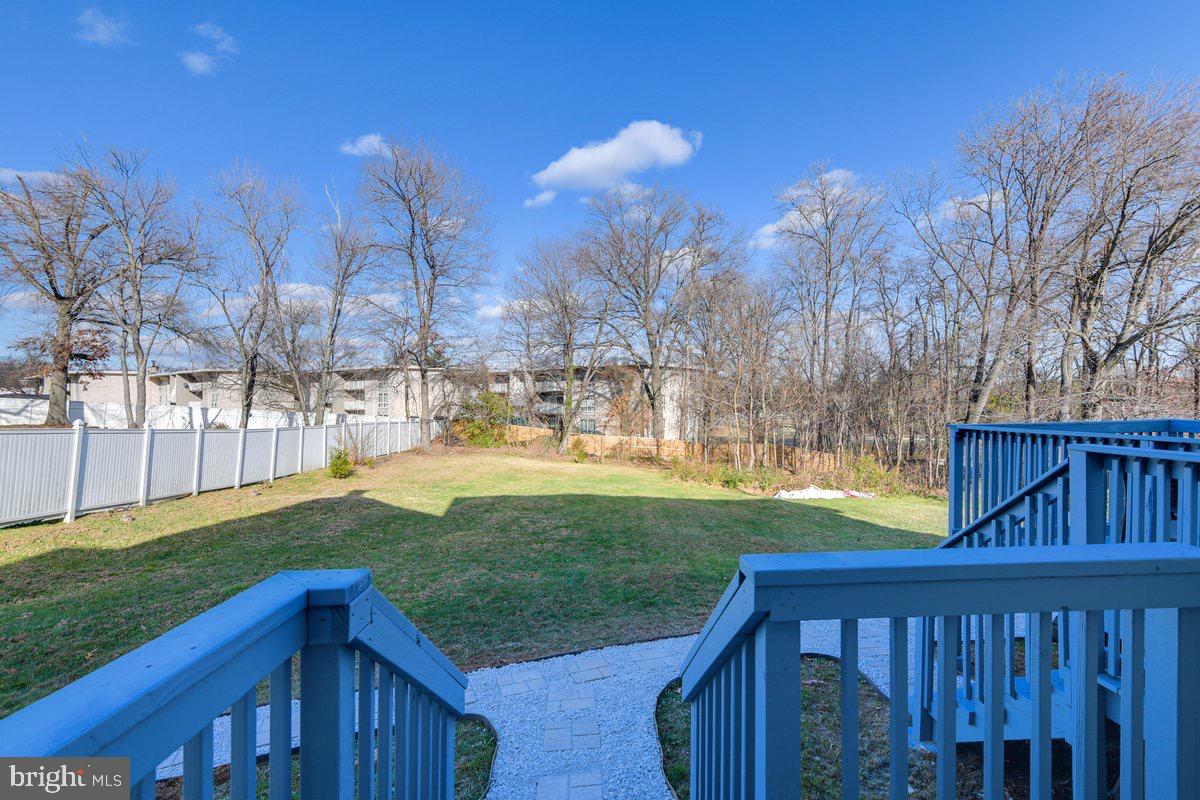 6604 Oak Street Cheverly, MD 20785 - Photo 16 of 16 a view of backyard with tree and a wooden fence