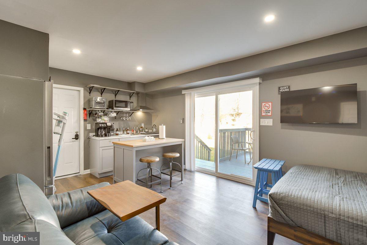 6604 Oak Street Cheverly, MD 20785 - Photo 2 of 16 a living room with furniture and a flat screen tv