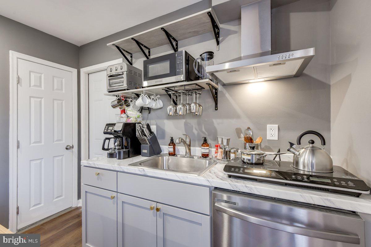 6604 Oak Street Cheverly, MD 20785 - Photo 5 of 16 a kitchen with a sink and cabinets