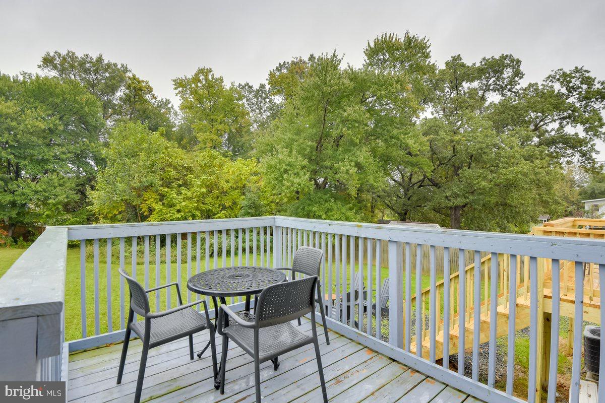 6604 Oak Street Cheverly, MD 20785 - Photo 8 of 16 a view of balcony with wooden floor and outdoor seating