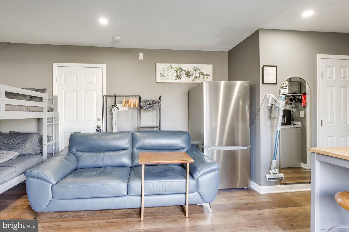 6604 Oak Street Cheverly, MD 20785 - Photo 9 of 16 a living room with furniture and a refrigerator